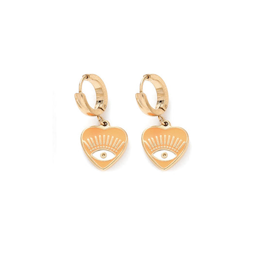 une paire de boucles d'oreilles en or avec un œil